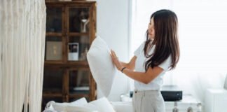 Woman cleaning cushion