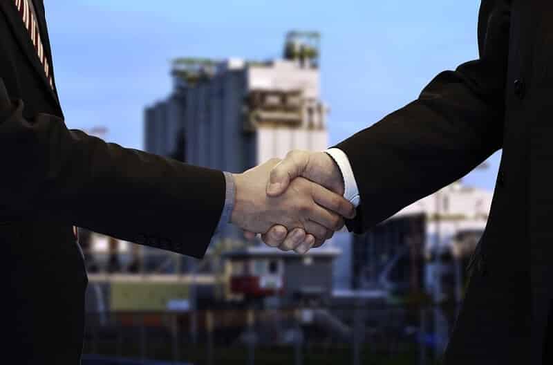 man handshake the business agreement