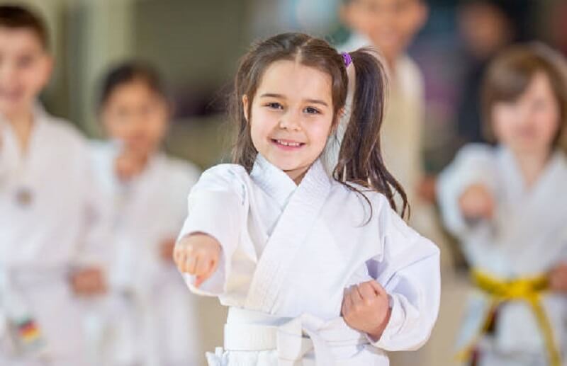 Little girl doing martial arts practice