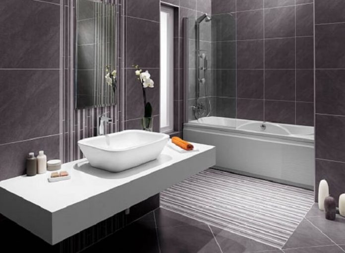 Bathroom with grey tiles