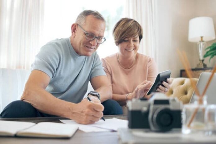 Old couple calculating the budget for savings