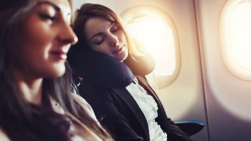 Woman sleeping during flight