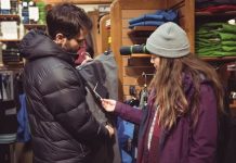 man and woman buying a winter clothes