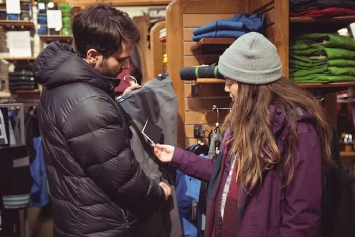 man and woman buying a winter clothes