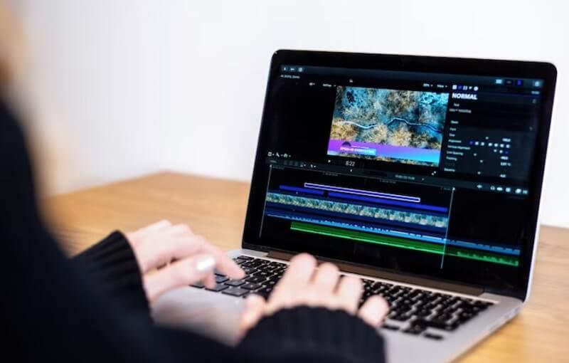 girl-editing-video-on-laptop