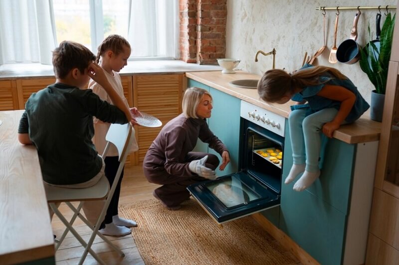 lady baking cookies with kids